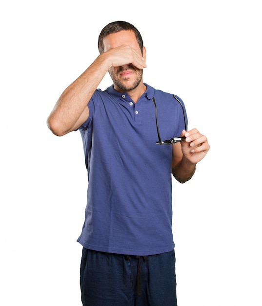 Scared young man on white background