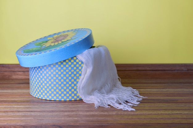 Scarf on a decorative hatbox