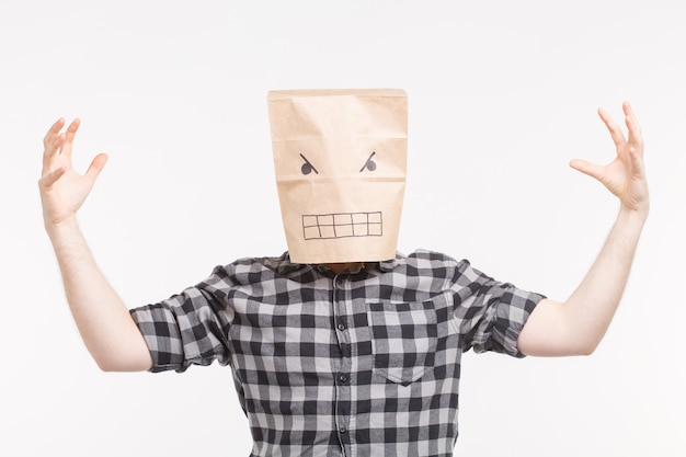 Scaring man in angry paper bag on his head