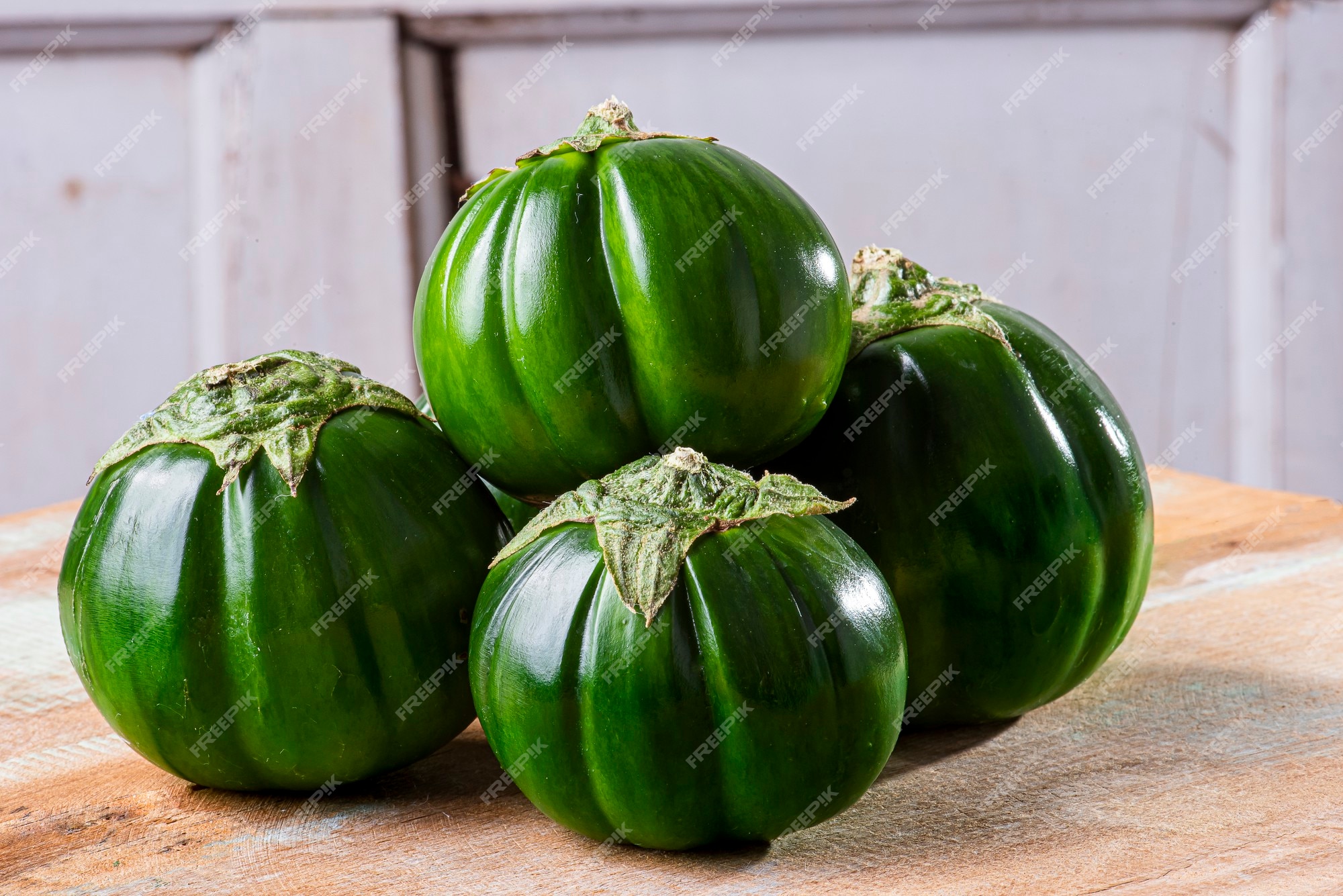 Premium Photo  Scarlet eggplant on a wooden board and wooden background