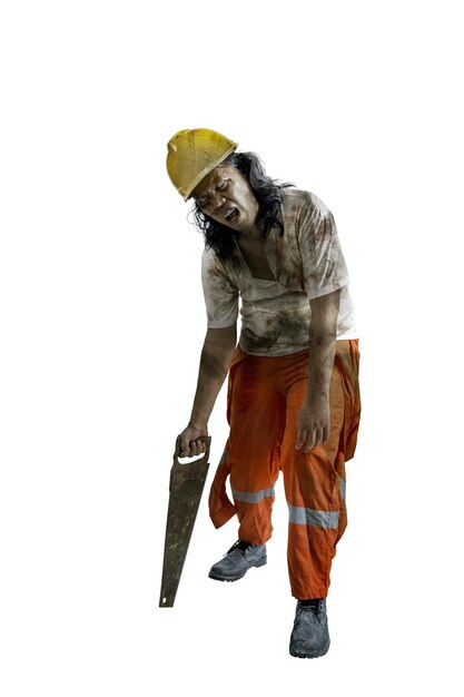 Photo a scary construction worker zombie with blood and wounds on his body walking while carrying a saw isolated over a white background