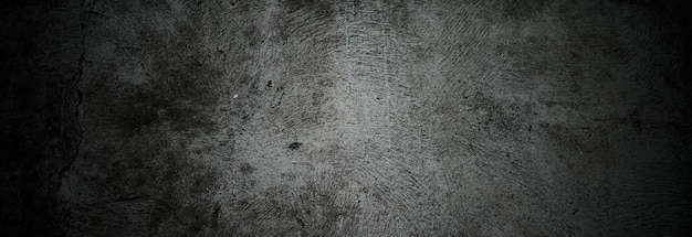 Scary dark walls slightly light black concrete cement texture for background Brush scratches on the wall