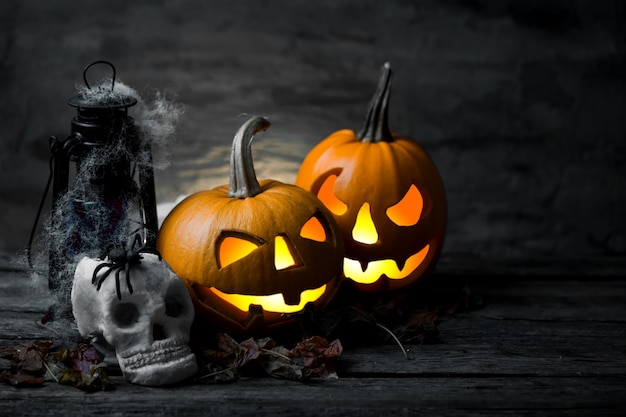 Scary halloween pumpkin with skull in a spooky night.