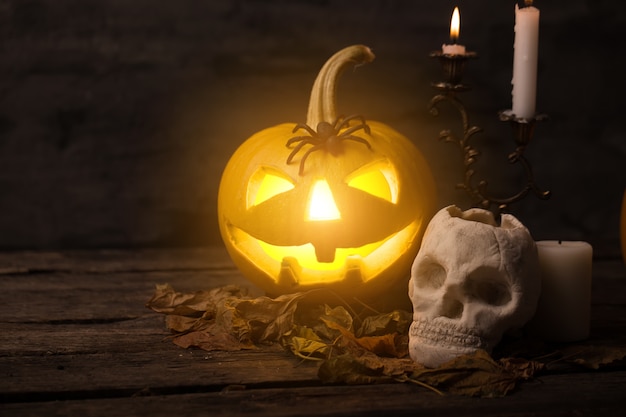 Scary halloween pumpkin with skull in a spooky night.