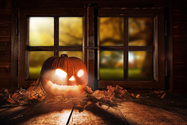 Scary halloween pumpkin on wooden planks