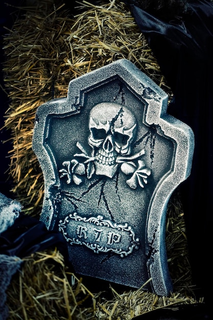 Scary Halloween Symbol Skull on Gravestone Background Photo