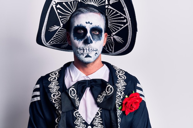 Scary man wearing day of the dead make up and costumbre from traditional ritual in Mexico