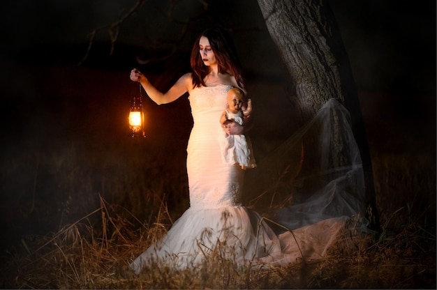 Scary woman with a lantern in night scene