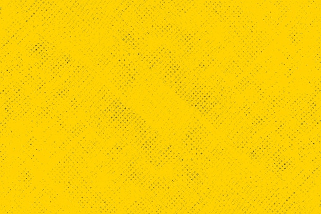 背景の黄色い紙に散在する黒いグランジテクスチャ