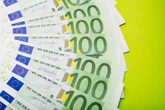 Scattered Money euro bills 100 hundred banknotes. Finance saving concept. Exchange Rates.