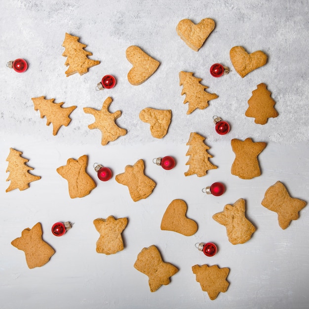 A scattering of Christmas cookies on a gray surface. Flat layout. Top view. Christmas and new year concept. Cooking