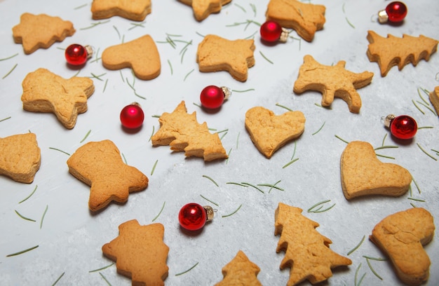 A scattering of Christmas cookies on a gray surface. Flat layout. Top view. Christmas and new year concept. Cooking