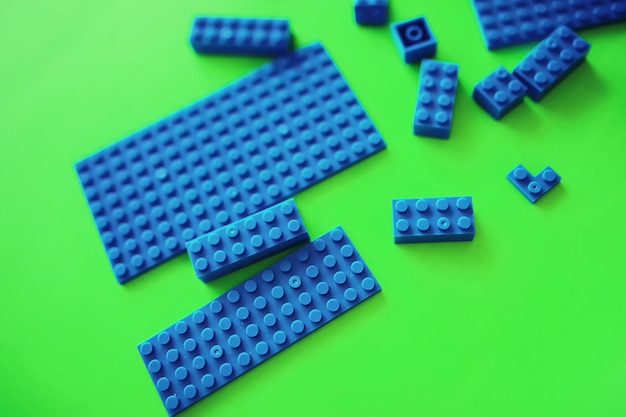 A scattering of constructor elements for children Colored blue bricks from the puzzle