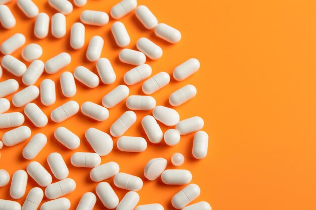 A Scattering of White Pills on an Orange Surface