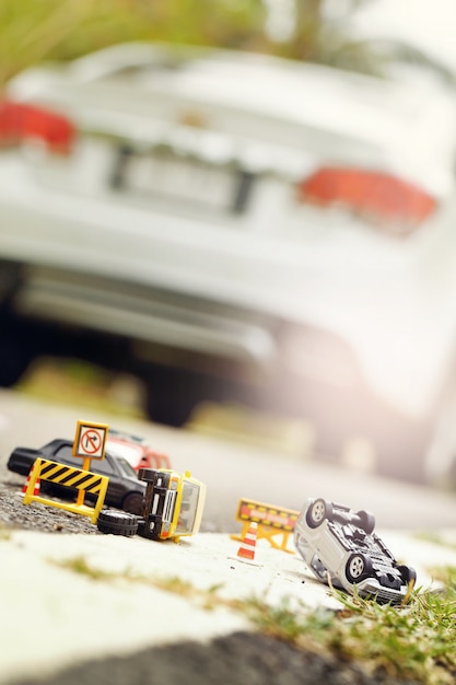 Photo scene of cars (miniature, toy model ) accident on street.insurance concept.