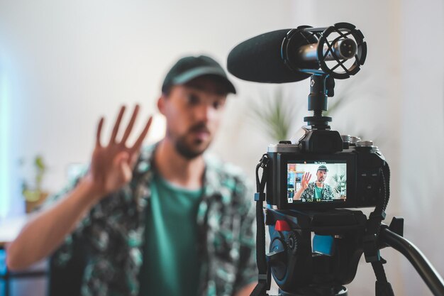 Behind the scene shot of a young man influencer making a video