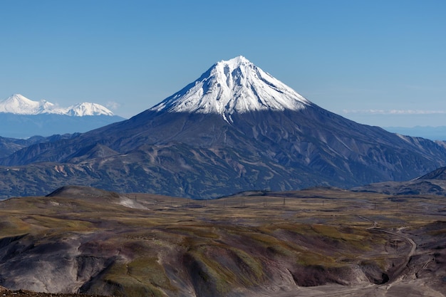 Scenery autumn mountain landscape view of snowcapped cone of volcano