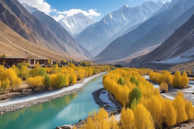 Photo scenery of green and yellow trees with snow covered mountains reflection ongizer riveron the way in gakuch