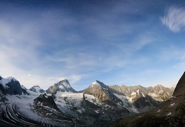 Scenery of mountains with stars on sky