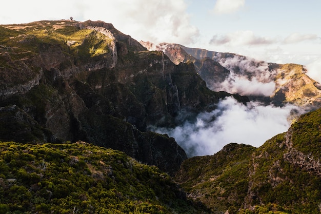 Scenery of rocky mountain range and clouds