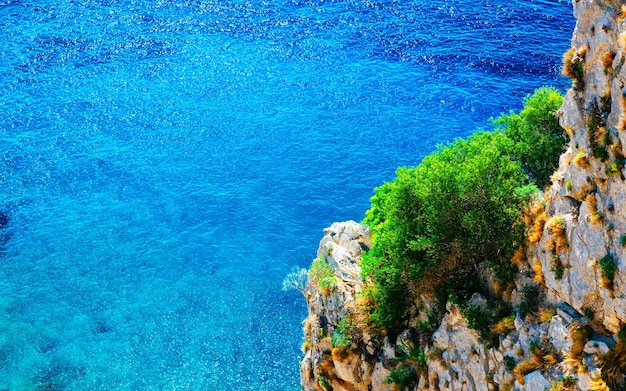 Scenery with Capri Island with Faraglioni of Italy at Naples. Amalfi and Solaro mountain. Landscape with Blue Mediterranean Sea at Italian coast. Panorama of Anacapri in Europe. View in summer.