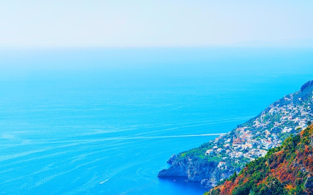 Scenery with walk on path of gods in italy at naples. amalfi coast and landscape with blue tyrrhenian sea at italian positano. panorama of amalfitana coastline in europe. view in summer