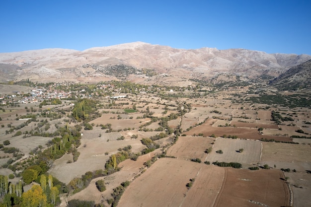 Scenic aerial view of mountain valley with agricultural fields