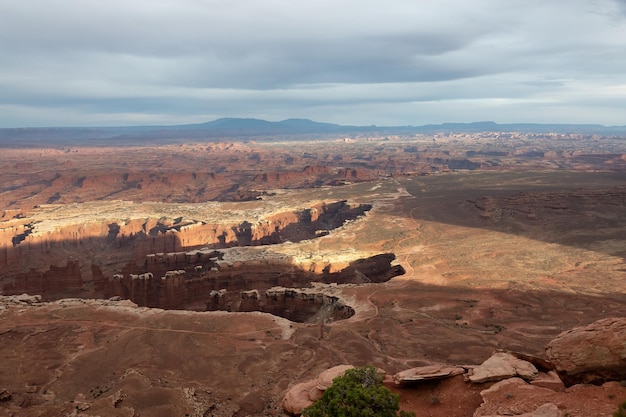 Scenic american landscape and red rock mountains in desert canyon