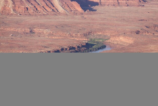 Scenic american landscape and red rock mountains in desert canyon