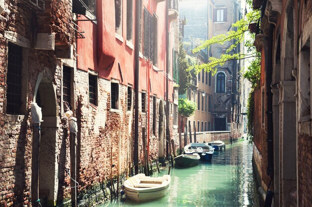 Scenic canal with ancient buildings in Venice, Italy