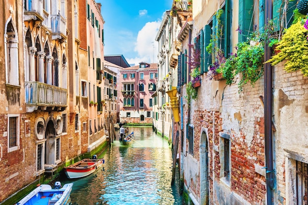 Scenic canal with ancient buildings in Venice, Italy