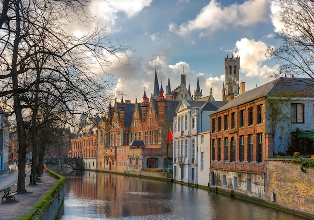 Scenic cityscape with a medieval tower Belfort and the Green canal Groenerei in Bruges Belgium