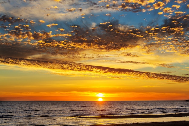 Scenic colorful sunset at the sea coast. Good for wallpaper or background image.