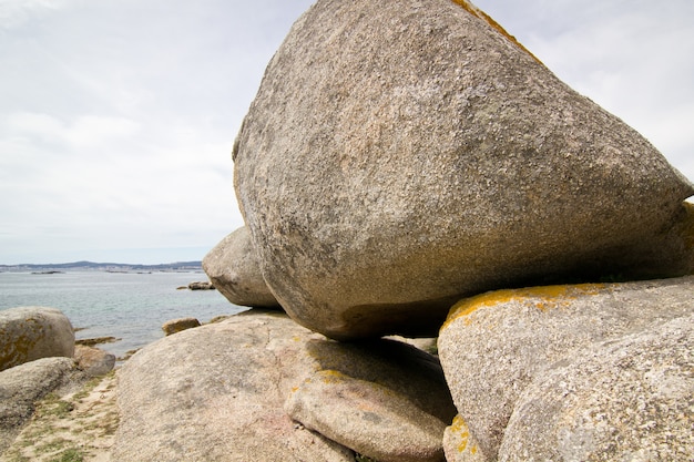 Scenic formation of big round rocks on atlantic shore. Arousa island, Pontevedra, Spain