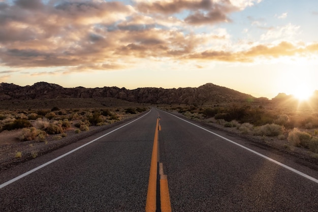 Scenic highway in the mountain landscape sunset sky