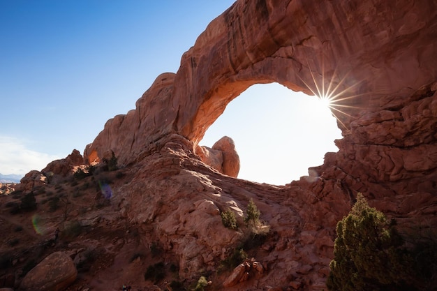 Scenic landscape of an Arch rock formation during a vibrant sunny day