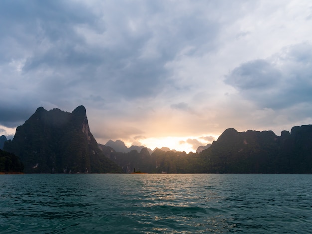 Scenic landscape of boat view in the big river and reservoir dam with mountain and nature forest