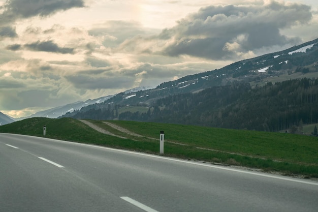 Scenic Mountain Road Landscape A Stunning Highway Journey through Colorful Nature in Europe Nature landscape on a beautiful highway car driving on the highway in spring