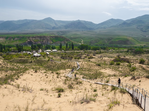 Scenic path to the Sarykum barkhan. Sand mountain in the Caucasus. Dagestan, Russia.