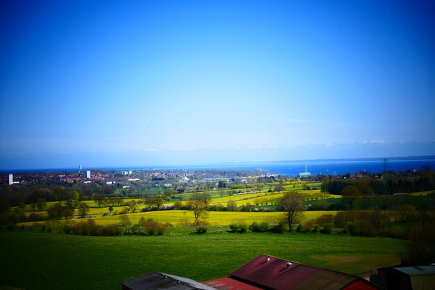 Scenic shot of landscape against blue sky