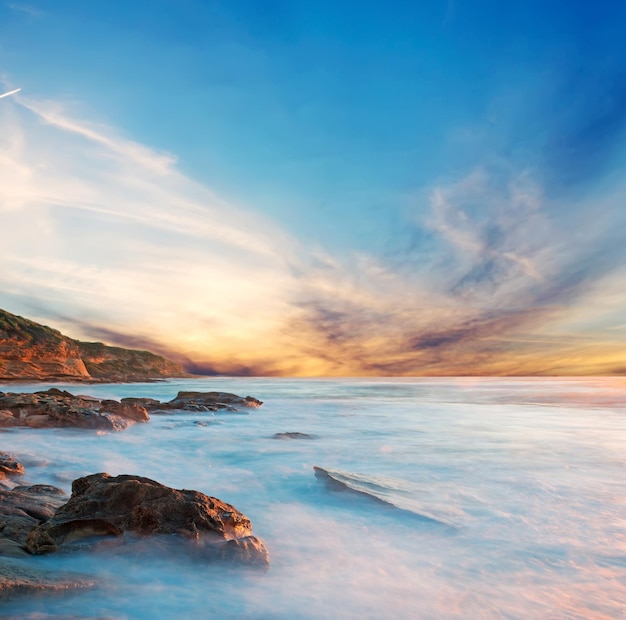 Scenic sunset in Castelsardo rocky shore