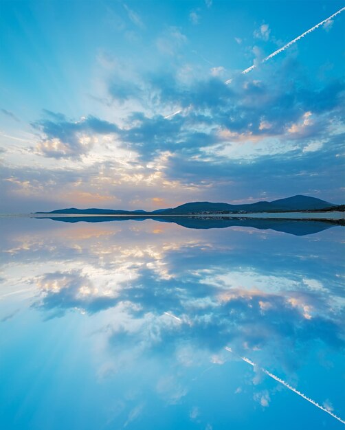 Photo scenic sunset with reflection in alghero coastline