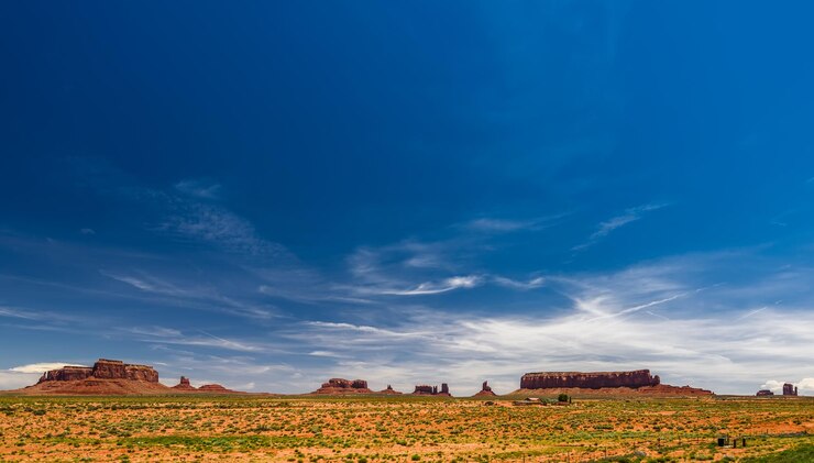 Photo scenic view of agricultural field against blue sky