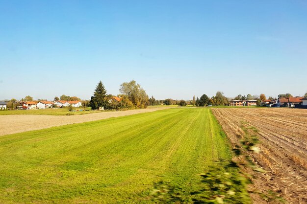 Photo scenic view of agricultural field against clear sky