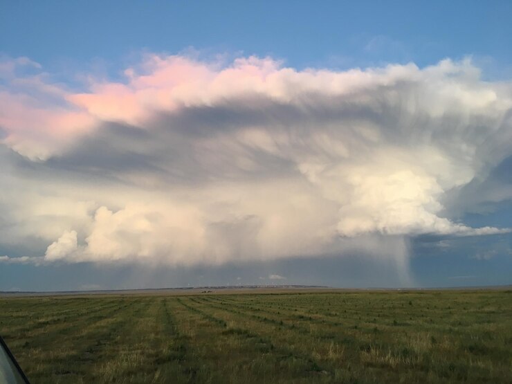 Photo scenic view of agricultural field against sky