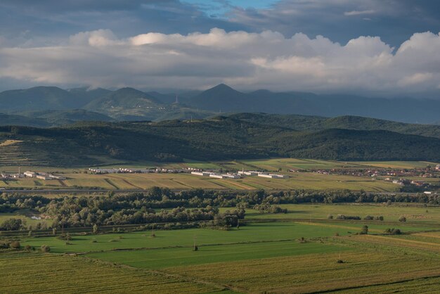 Scenic view of agricultural field and mountains against sky
