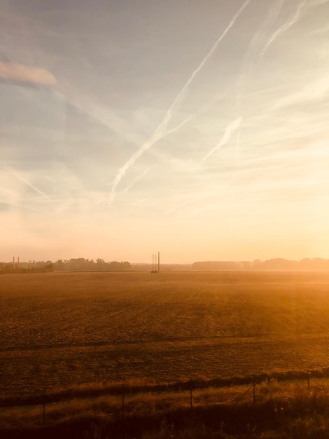 Photo scenic view of arid climate against sky during sunset