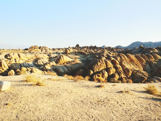 Scenic view of arid landscape against clear sky