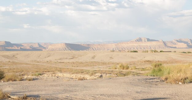 Scenic view of arid landscape against sky