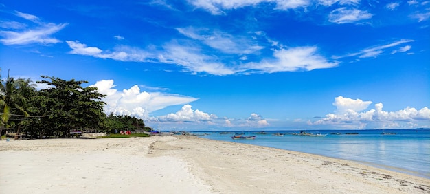 Scenic view of beach against blue sky